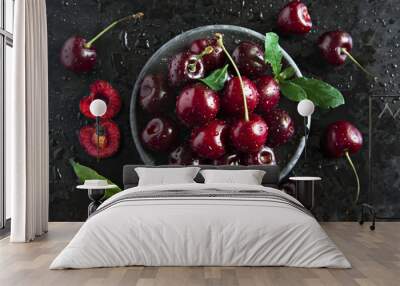 Composition of sweet cherries on a dark background with water drops top view Wall mural