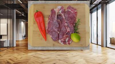 fresh beef meat on a cutting board with lemon and rosemary Wall mural