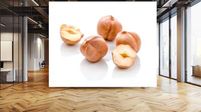 Full and halfs of hazelnuts on white background. Isolated Wall mural