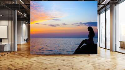 Girl looking sunset Wall mural