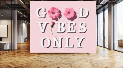 good vibes only. motivational quote from white letters and beauty natural flowers on pink background Wall mural