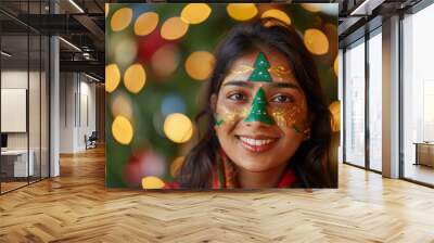 holiday greeting card with Christmas smiling indian woman with painted gold and green christmas tree on face, festive background Wall mural