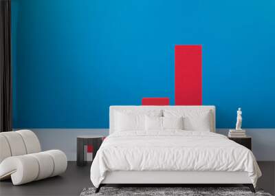 Business graph diagram or performance chart with red bars and rise dynamic against blue background Wall mural