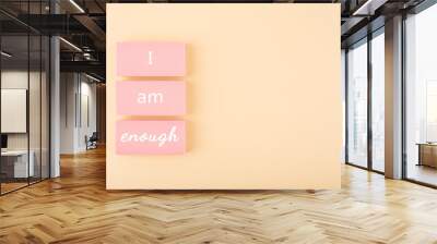 I am enough minimal concept on bright pastel beige background with copy space. Mental health and self love concept Wall mural