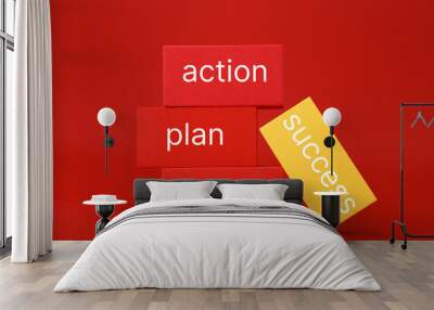 Success formula or strategy concept in red colors. Goal, plan, action written on red and yellow rectangles against red background Wall mural