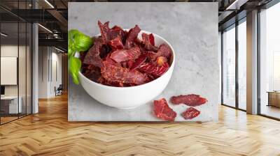 Jerky Beef, Jerky in white bowls on a concrete background. Rustic country style dried meat. Delicious meat snack. Wall mural