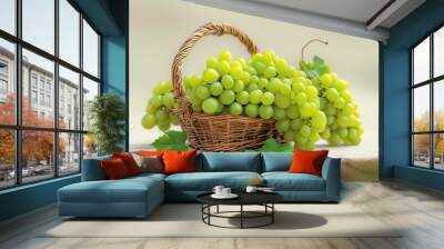 wicker basket filled with green grapes on a stone ledge Wall mural