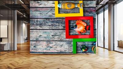 Marine theme - ceramic fish in multi-colored frames Wall mural