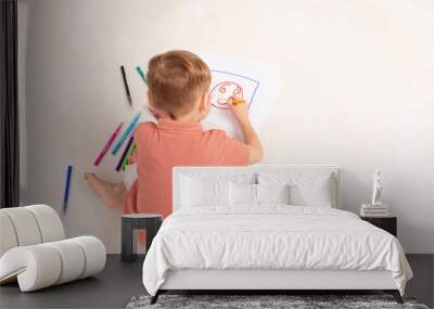 Cute child little boy drawing with pencils isolated on white. Child education. Creation. Childhood Wall mural