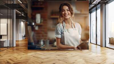 Professional young female cook in uniform apron prepares delicious meal for guests in cuisine kitchen in hotel restaurant. Portrait of happy beautiful smiling woman chef baking in cuisine, enjoying Wall mural