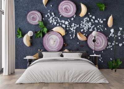 red onion and spices isolated on black background, top view Wall mural