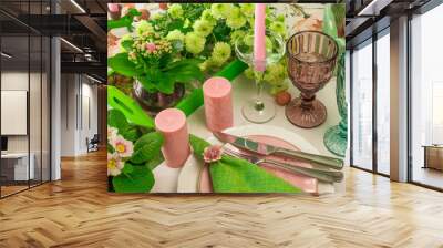 Romantic spring table setting for two with wine glasses, candles and flowers Wall mural