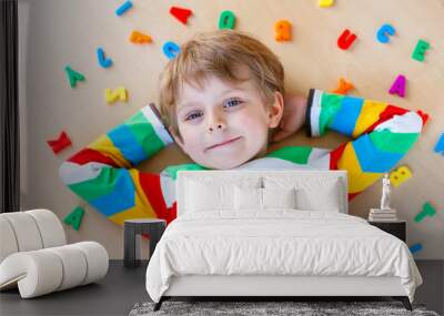 Kid boy with colorful numbers, indoor Wall mural