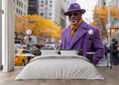 Stately Afro-American man in purple stylish coat and hat on the street of a modern city. Wall mural