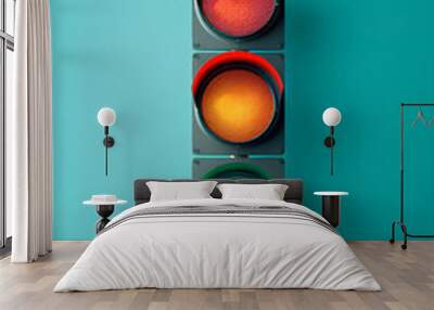 Traffic light on blue background with copy space. Close up glowing traffic signal on evening sky. Traffic control, road safety and regulation on road concept. Red, yellow and green lights on semaphore Wall mural