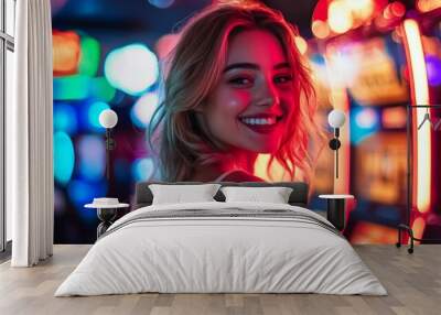 A young woman smiles brightly while standing in front of colorful slot machines. The vibrant neon lights create a lively atmosphere. This image captures joy and excitement in a casino setting. AI Wall mural