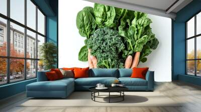 Fresh greens held in hands create a vibrant display of health. This image showcases kale, spinach, and leafy greens. Perfect for nutrition, wellness, and healthy eating. AI Wall mural