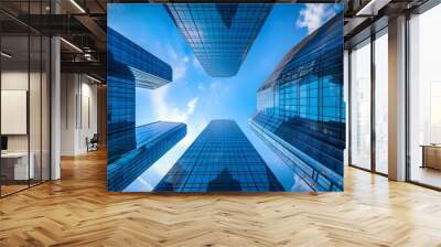 Modern skyscrapers reaching for the sky, a dynamic urban perspective. Glass facades reflecting blue skies. Architectural symmetry in modern design. Ideal for corporate backgrounds. AI Wall mural