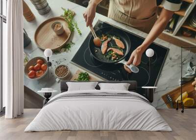 Top view of a modern kitchen setup with a person cooking salmon. Healthy cooking concepts and kitchen lifestyle. This image showcases fresh ingredients and a stylish, organized kitchen environment. AI Wall mural