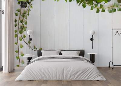 White wooden background with leaving green ivy branches Wall mural