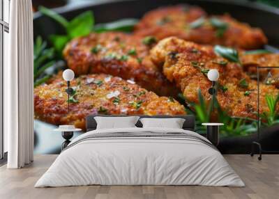 Crispy breaded seitan schnitzel with fresh rosemary in a skillet Wall mural