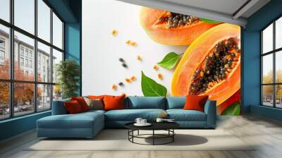 Sliced papaya with black seeds on a white background. Fresh papaya fruit with green leaves for healthy eating. Ripe papaya slices perfect for a nutritious breakfast. Wall mural