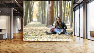 mother and the kid walk in autumn park Wall mural