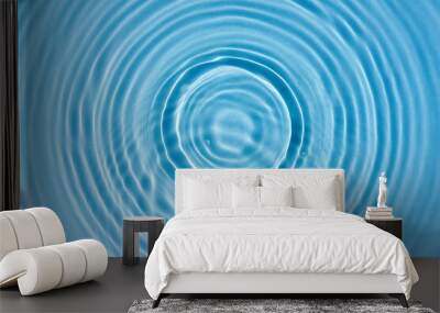 Abstract background, blue water texture with round ripples, close up Wall mural