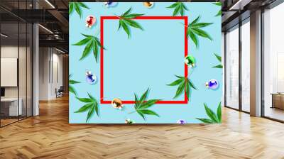 Christmas background, Christmas decor. Pattern of hemp leaves, cannabis and Christmas decorations on a blue background. Wall mural