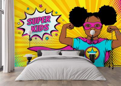 wow face. cute surprised afro american black little girl dressed like superhero shows her power and  Wall mural