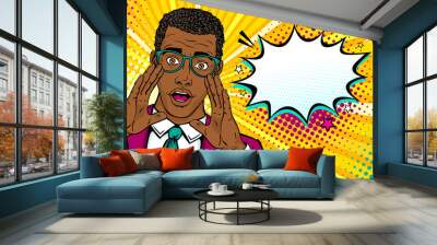 Wow male face. Young surprised afro american man in suit and glasses with open mouth and rising hands screaming announcement and empty speech bubble. Vector background in comic retro pop art style.  Wall mural