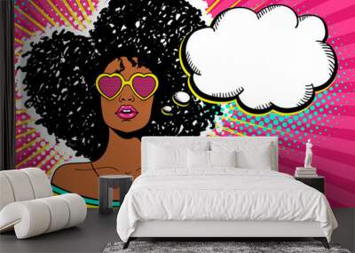 Wow pop art face. Sexy woman with black afro curly hair and open mouth and sunglasses in form of heart and empty speech bubble. Vector bright background in pop art retro comic style. Party invitation. Wall mural