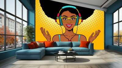 Young sexy african american black woman with open smile in headphones listening to the music and spreading her hands. Vector bright background in pop art retro comic style. Party invitation poster. Wall mural