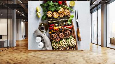 a large wooden tray with a Summer snack, colorful Barbecue Vegetables, cherry tomatoes and greens. summer delicious healthy food for a big company of people or friends Wall mural