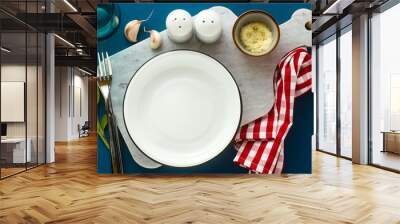 banner of empty served plate on marble serving board and blue spice background Wall mural