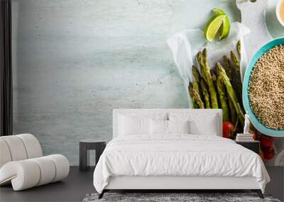 banner of grain Sorghum or great milet with green asparagus and cherry tomatoes on the table. ingredients for gluten-free recipes. healthy cuisine for people with celiac disease Wall mural