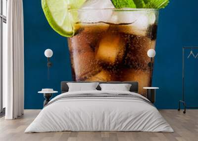 Coca Coke cocktail in a tall glass cuba libre. refreshing summer drink Wall mural