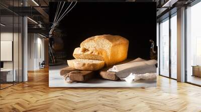 Fresh homemade Toast bread on the kitchen table, dark background. Wall mural