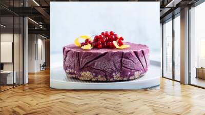 frozen blueberry lemon cake from ice cream and fresh berries on a cake stand on a marble table. summer festive dessert Wall mural