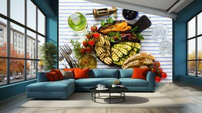 grilled vegetables on the table with white wine, fresh bread and aromatic herbs. summer menu Wall mural