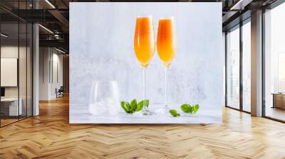 summer alcoholic fruit drink in glasses for champagne. on the marble table. with ice. refreshing cocktail Wall mural