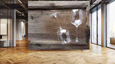 two empty wine glass on a wooden surface. for background Wall mural