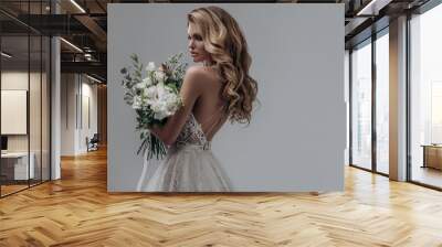 beautiful sexy blonde bride posing in a sparkling wedding dress with bouquet. advertising space Wall mural