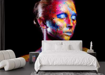 Portrait of a woman with colorful paint brushstroken on face. Bright blue eyes. Advertising Space Wall mural