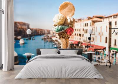 Delicious icecream in beautiful Venezia, Italy in front of a canal and historic buildings Wall mural