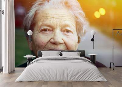 Portrait of happy older lady outdoors Wall mural