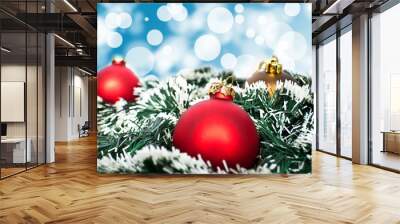 Red and golden christmas ornament ball against blue bokeh backgr Wall mural