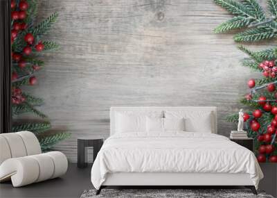 Festive Winter Christmas and New Year Holiday Evergreen Branches and Red Berries Frame on Sides Over Rustic Light Wood Horizontal Background Texture with Copy Space Wall mural