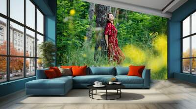 Connecting with nature benefits mental health. Nature Therapy Ecotherapy Helps Mental Health. Nature Impact Wellbeing. Woman in red dress enjoying nature Wall mural