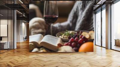 Embracing self-care during Thanksgiving with a cozy meal and a good book in a warm apartment Wall mural